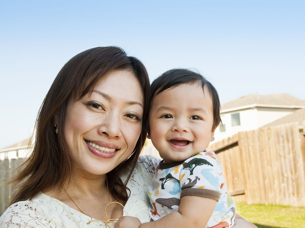 woman holding young child