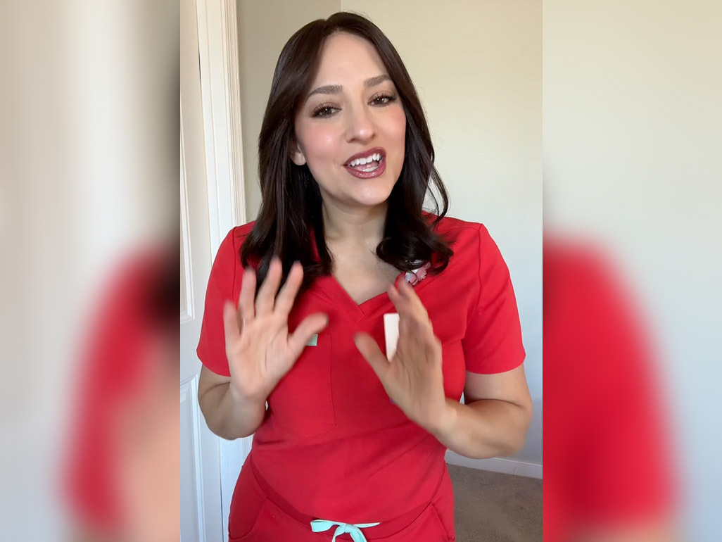 Labor Junkie wearing scrubs, talking to the camera